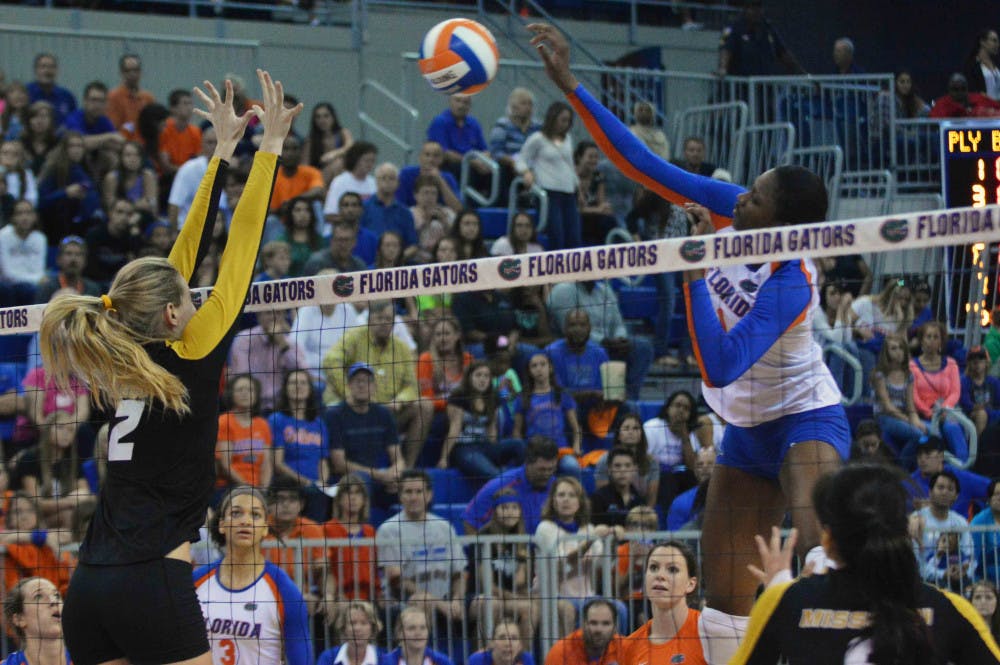 Rhamat Alhassan (1) swings for a kill attempt during Florida's 3-0 win against Missouri on Oct. 24 in the O'Connell Center.