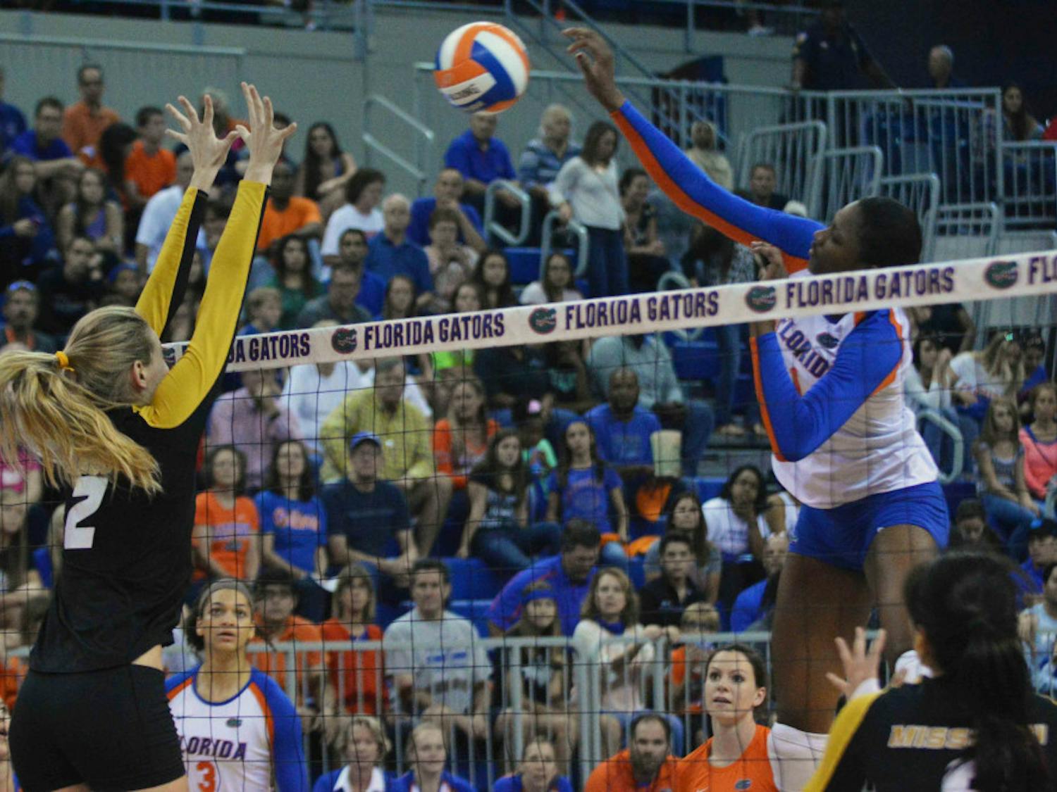 Rhamat Alhassan (1) swings for a kill attempt during Florida's 3-0 win against Missouri on Oct. 24 in the O'Connell Center.