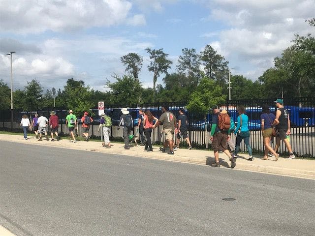 Rhett Barker, 24, lead 25 hikers down Hawthorne Trail for a six-mile hike. Saturday was the second hike organized by Barker and some friends to tell lawmakers to invest in conservation land.