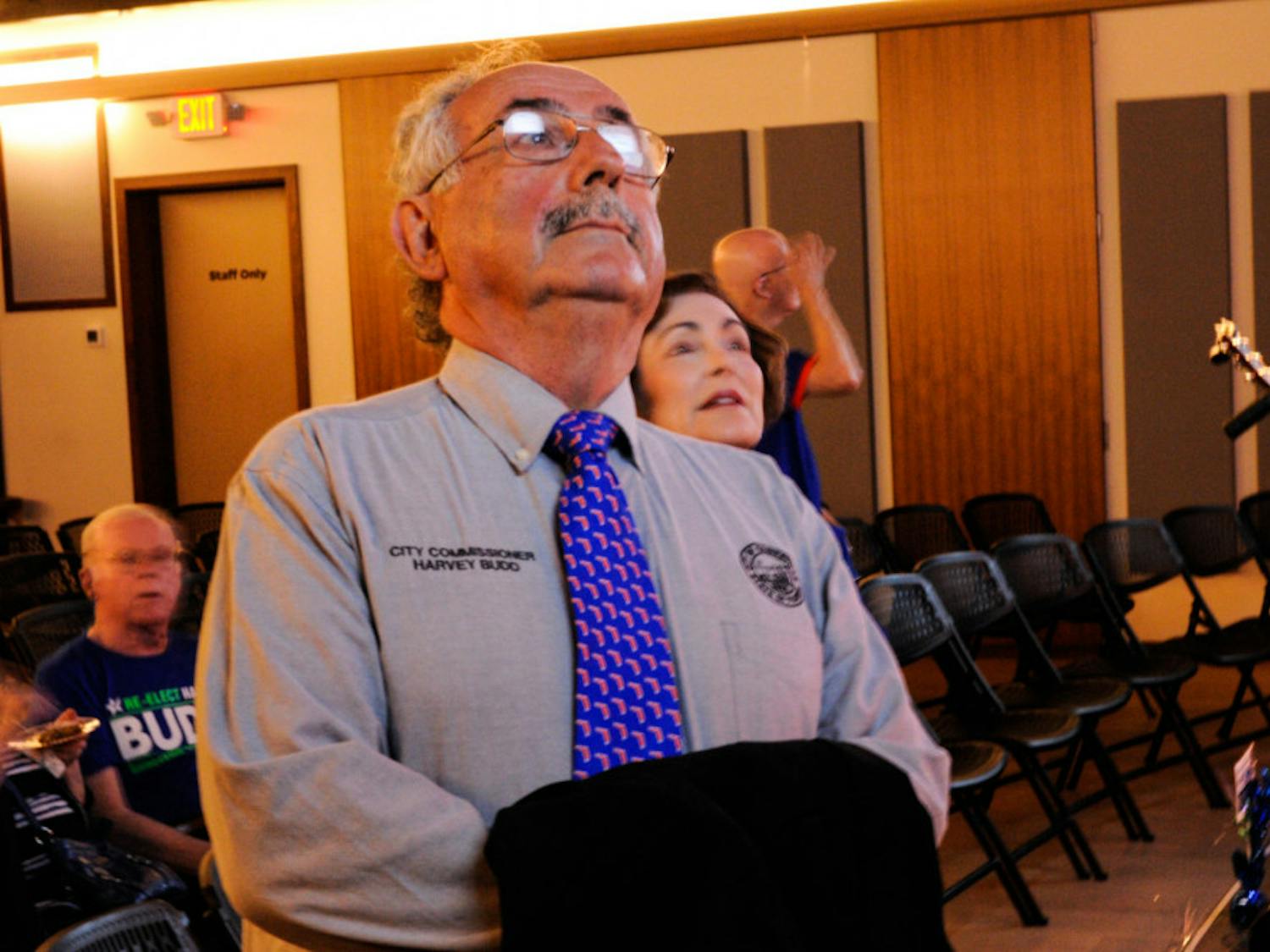 Harvey Budd and his wife Ilene Silverman-Budd watch the results of the City Commision election with fellow supporters.
&nbsp;