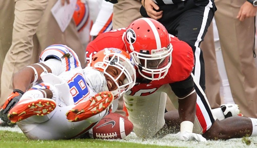 <p><span>Junior Solomon Patton is tackled by Georgia safety Shawn Williams during UF's 17-9 loss on Saturday at EverBank Field. Patton suffered a broken left arm on the play.&nbsp;</span></p>
<div><span><br /></span></div>