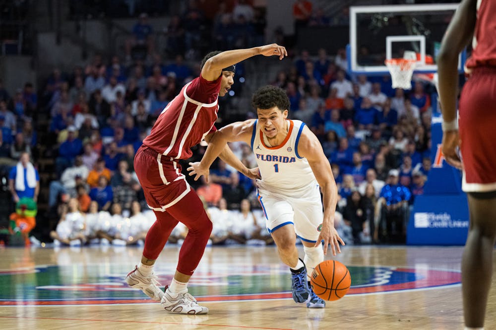 Florida Gators guard Walter Clayton Jr. (1) drives with the ball in a basketball game against Oklahoma on Tuesday, Feb. 18, 2025, in Gainesville, Fla.