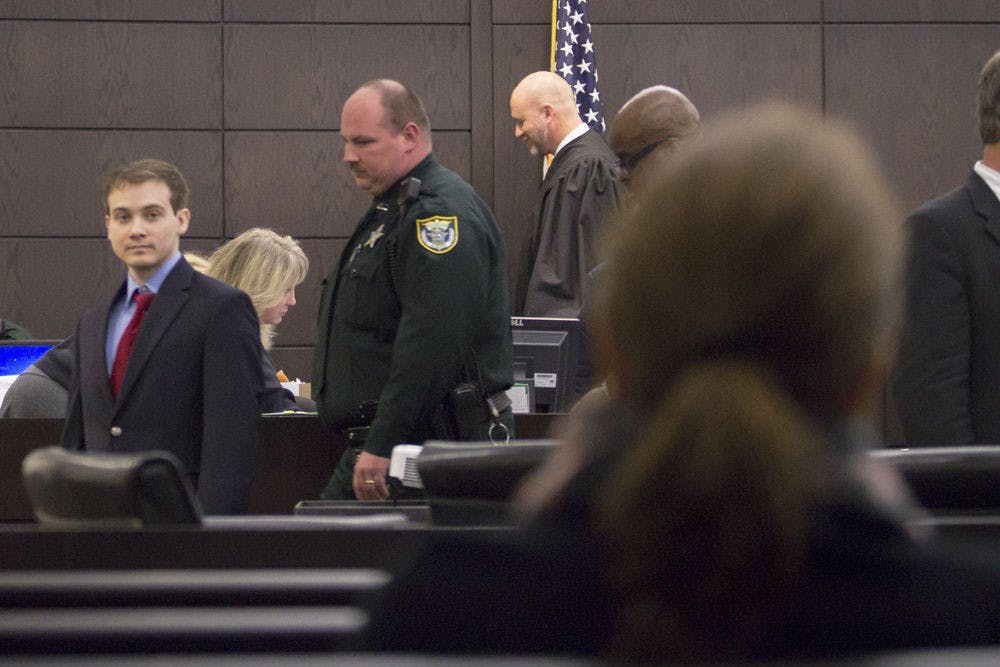 Pedro Bravo, who is accused of the first-degree murder of Christian Aguilar, glances back at his mother during Wednesday’s court proceedings. He was the last person seen with Aguilar on Sept 20, 2012.