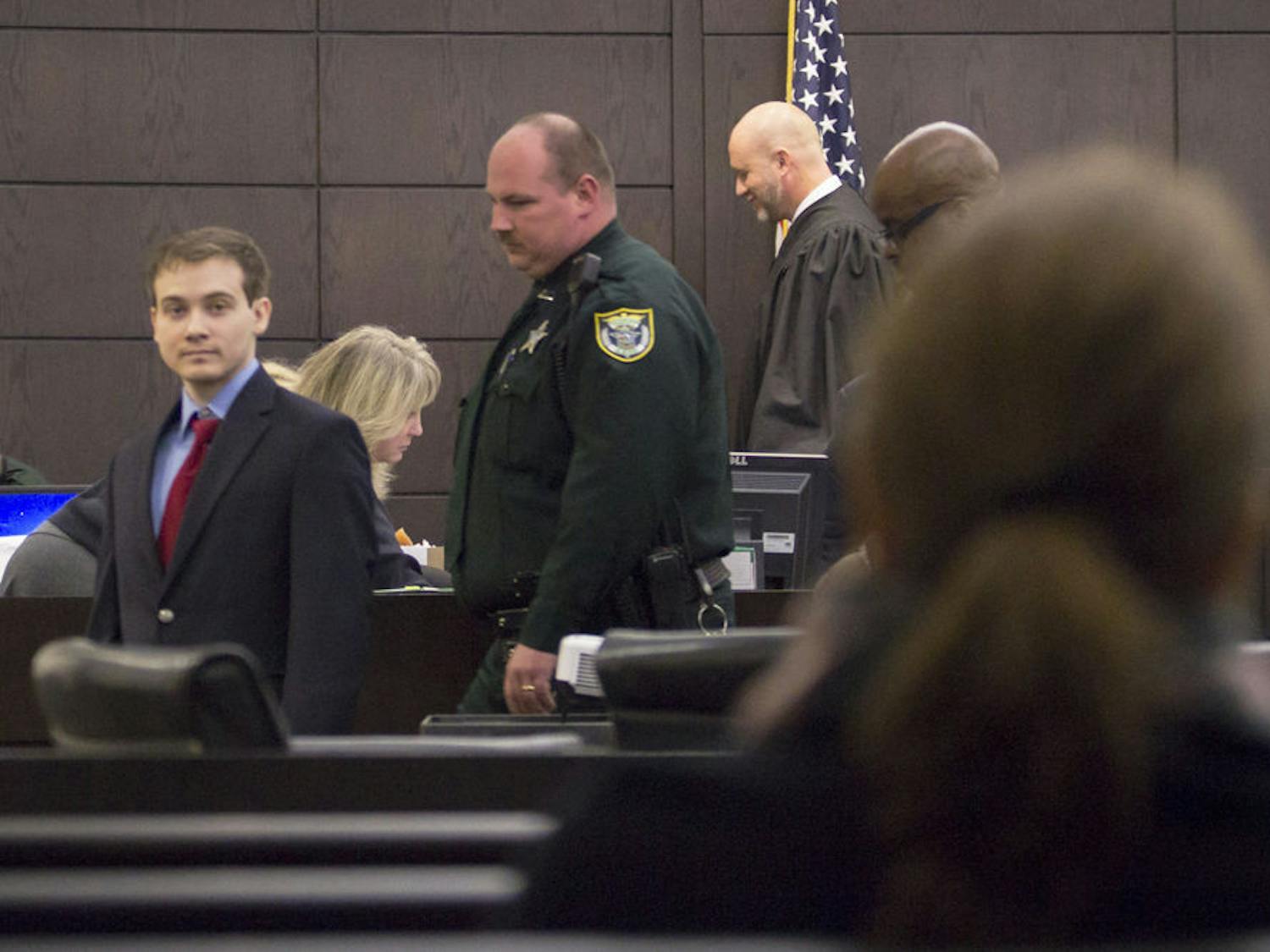 Pedro Bravo, who is accused of the first-degree murder of Christian Aguilar, glances back at his mother during Wednesday’s court proceedings. He was the last person seen with Aguilar on Sept 20, 2012.