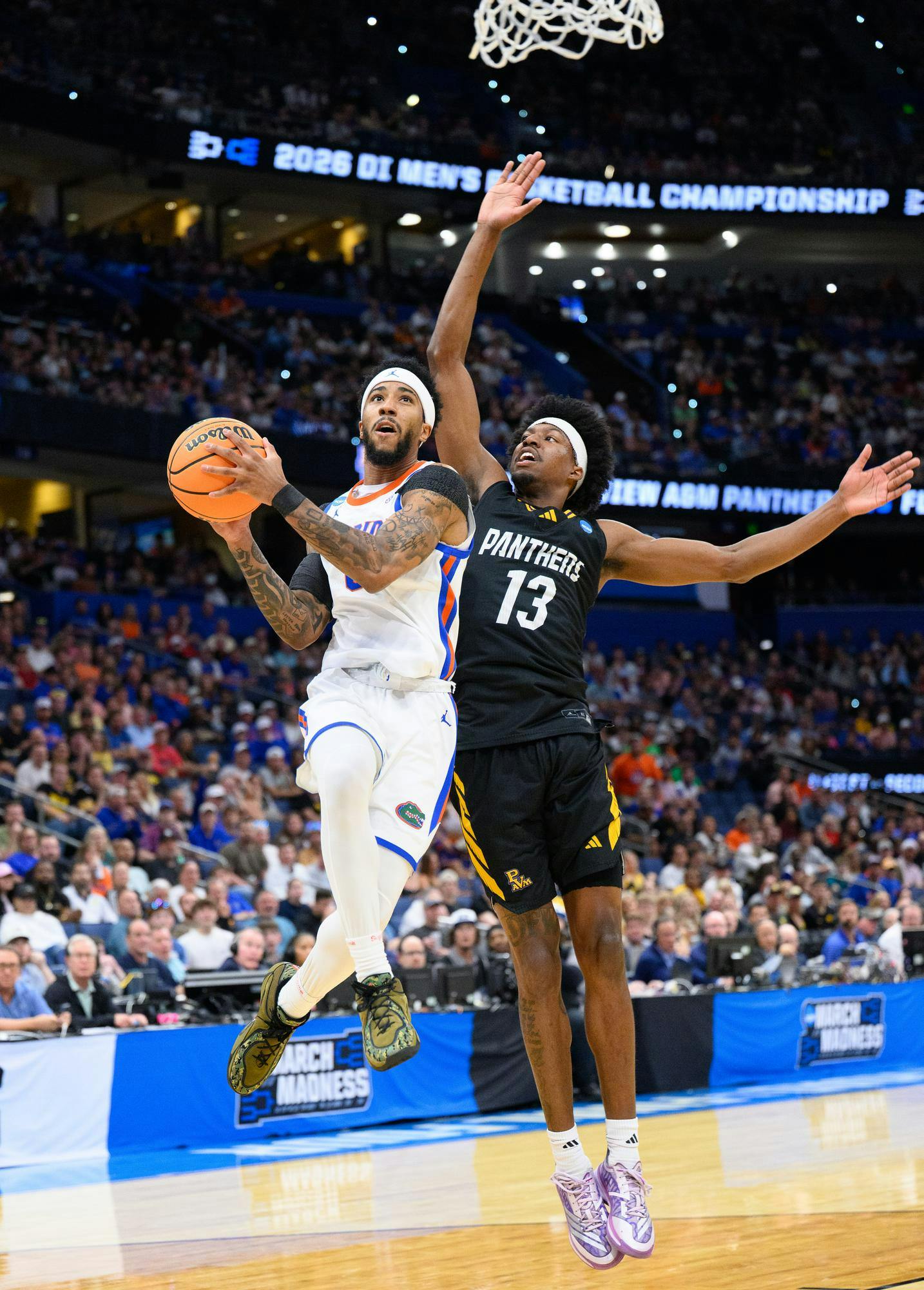 Florida guard Boogie Fland (0) shoots a layup during the first half of an NCAA Tournament first round game against Prairie View A&M, Friday, March 20, 2026, in Tampa, Fla.