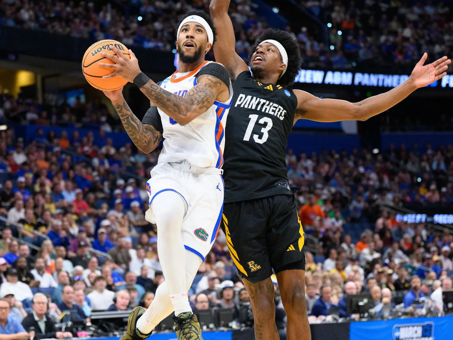 Florida guard Boogie Fland (0) shoots a layup during the first half of an NCAA Tournament first round game against Prairie View A&M, Friday, March 20, 2026, in Tampa, Fla.