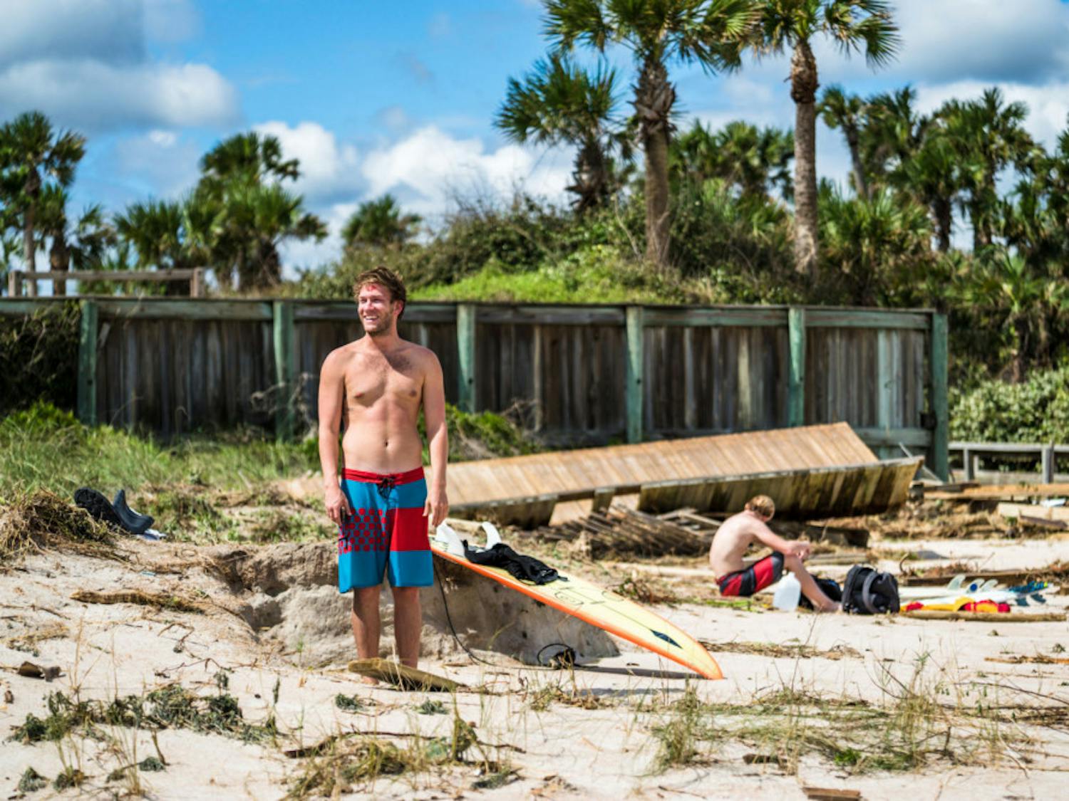 Jake Turner, a 25-year-old Jacksonville local, laughs off a crash after surfing at Ponte Vedra Beach on Saturday.