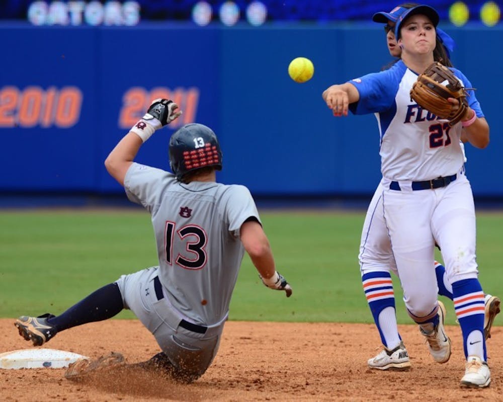 <p>Auburn's Caitlin Schultze is thrown out on a fielders choice (4-6) as Cheyenne Coyle throws to first during the top of the 4th inning, Sunday, April 15th, 2012.</p>