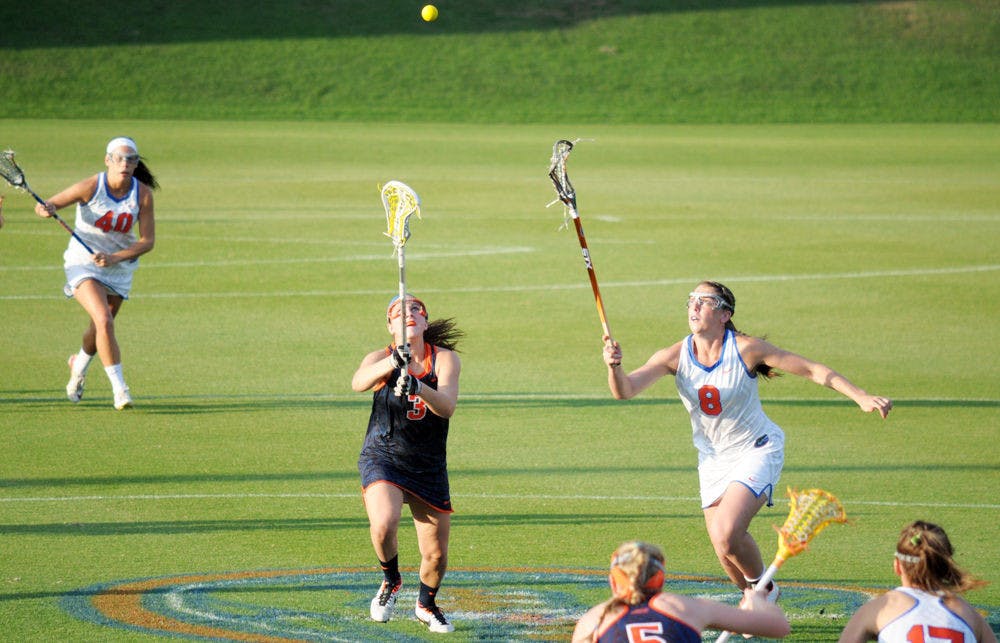 Shannon Gilroy fights for a draw control during Florida's 14-13 overtime loss to Syracuse on Tuesday at Donald R. Dizney Stadium.