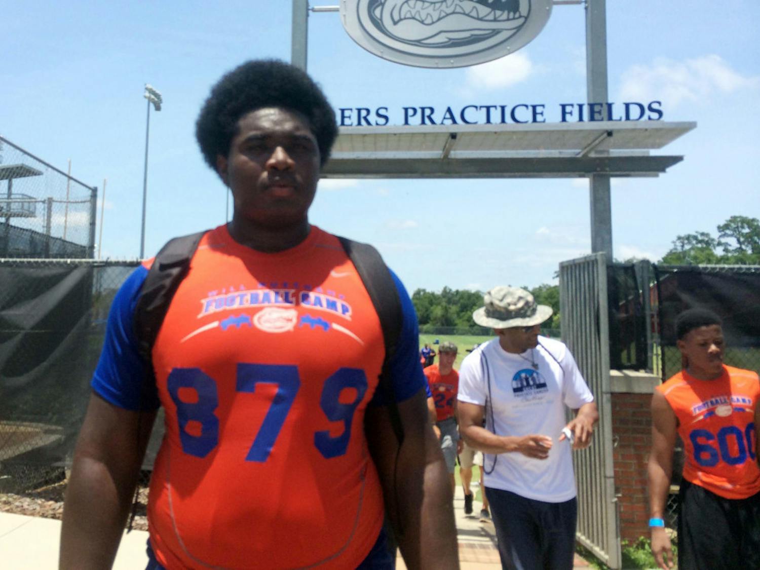 Three-star offensive tackle Jalen Merrick walks off of the Sanders Practice Fields on Saturday. Merrick has been committed to UF since January.