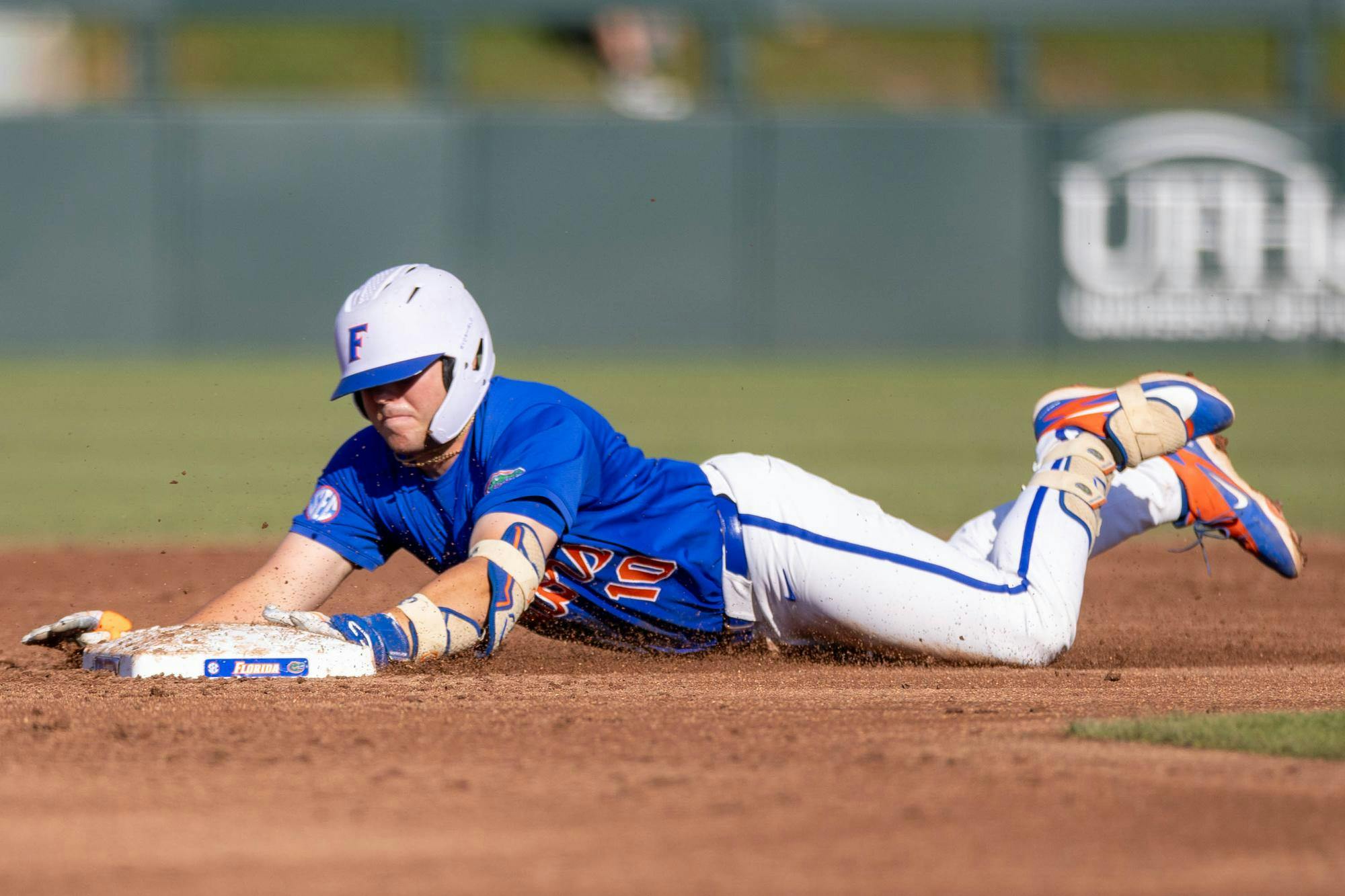 Florida infielder Ethan Surowiec (10) slides to second base during an NCAA college baseball game against Auburn at Condron Family Ballpark in Gainesville, Fla., Friday, April 17, 2026.