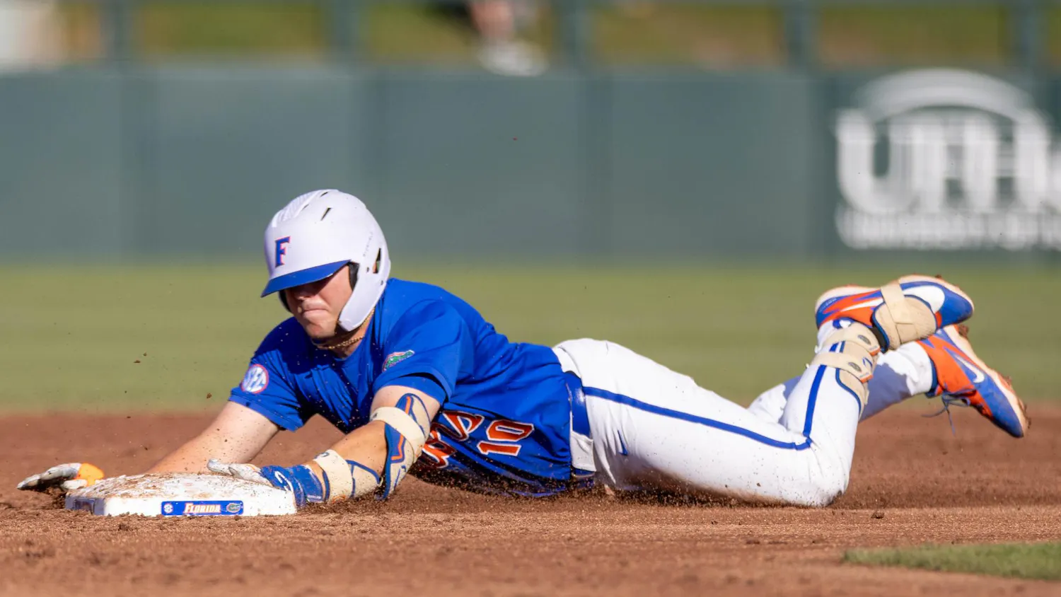 Florida infielder Ethan Surowiec (10) slides to second base during an NCAA college baseball game against Auburn at Condron Family Ballpark in Gainesville, Fla., Friday, April 17, 2026.