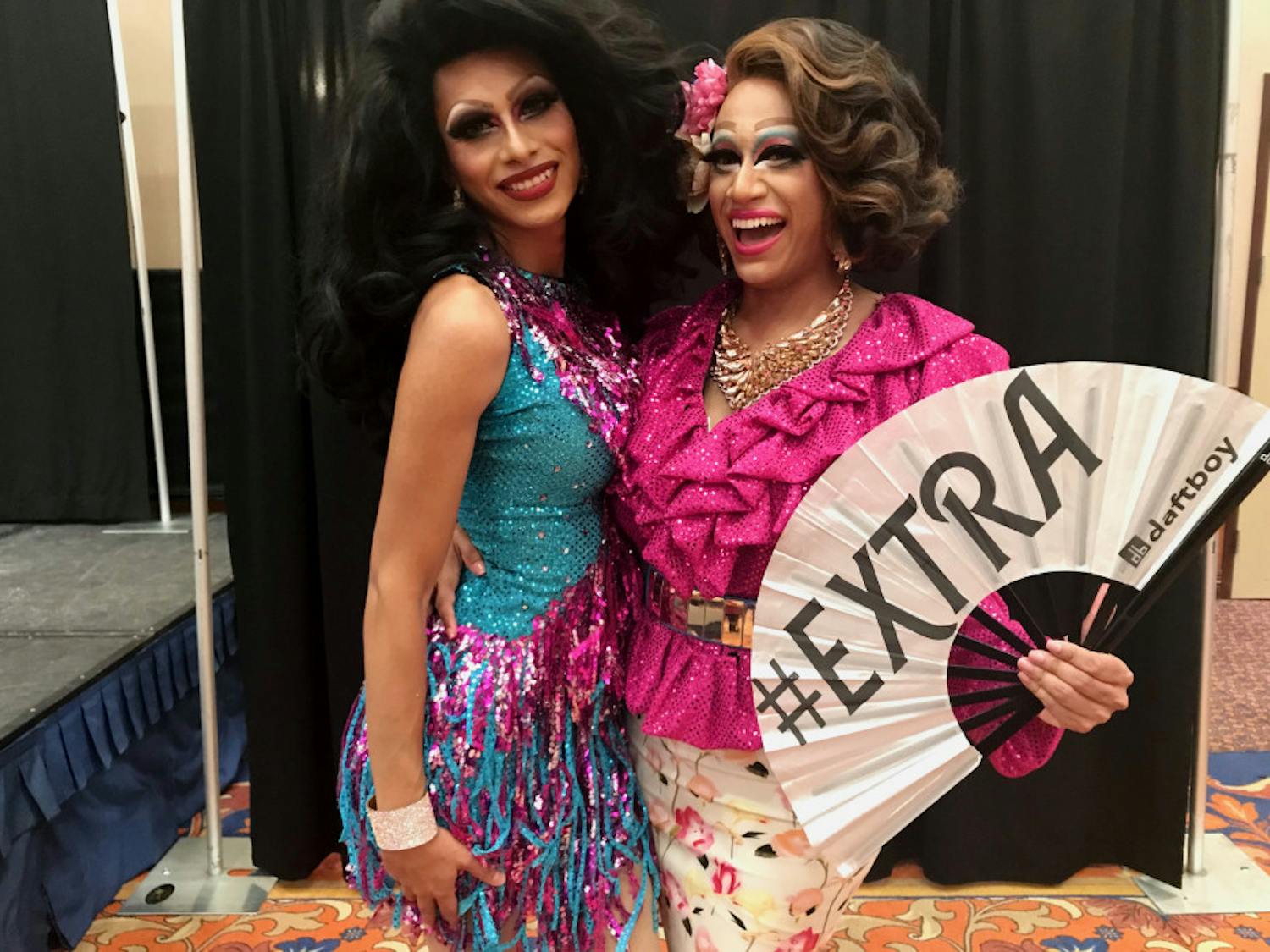 Deafies in Drag stars Casa Vina (left) and Selena Minogue (right) pose with their fan.