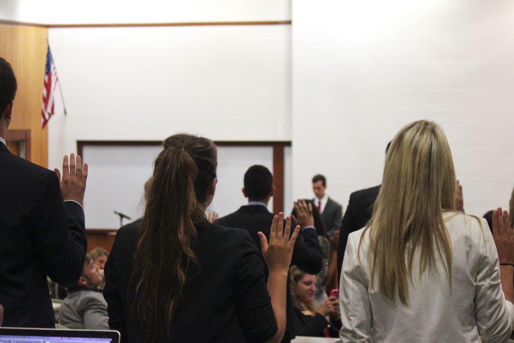 <p class="p1">Members of the new 2014-2015 UF Student Senate are sworn in at Tuesday’s meeting.</p>