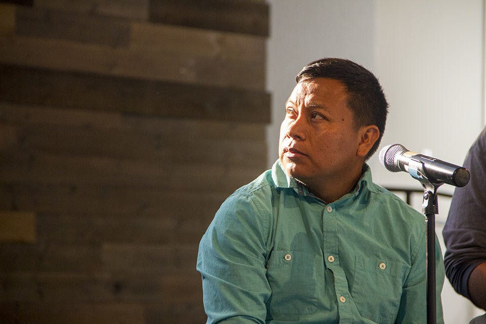 Representative for the Coalition for Immokalee Workers Oscar Otzoy watches a video&nbsp;Tuesday&nbsp;depicting the injustices faced by local farmers. The Coalition for Immokalee Workers is instituting a ban on Wendy's because they believe the company does not provide its farmworkers a livable wage and humane working conditions.