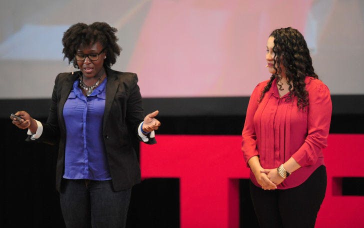 Bertrhude Albert, left, and Priscilla Zelaya speak at TEDxUF on Saturday in the University Auditorium. In 2011, the two co-founded a Gainesville-based nonprofit called Projects for Haiti, Inc., in effort to see sustainable development and growth in Haiti.