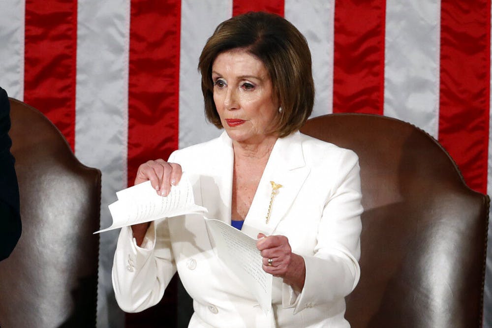 <p>House Speaker Nancy Pelosi of Calif., tears her copy of President Donald Trump's State of the Union address after he delivered it to a joint session of Congress on Capitol Hill in Washington, Tuesday, Feb. 4, 2020. (AP Photo/Alex Brandon)</p>