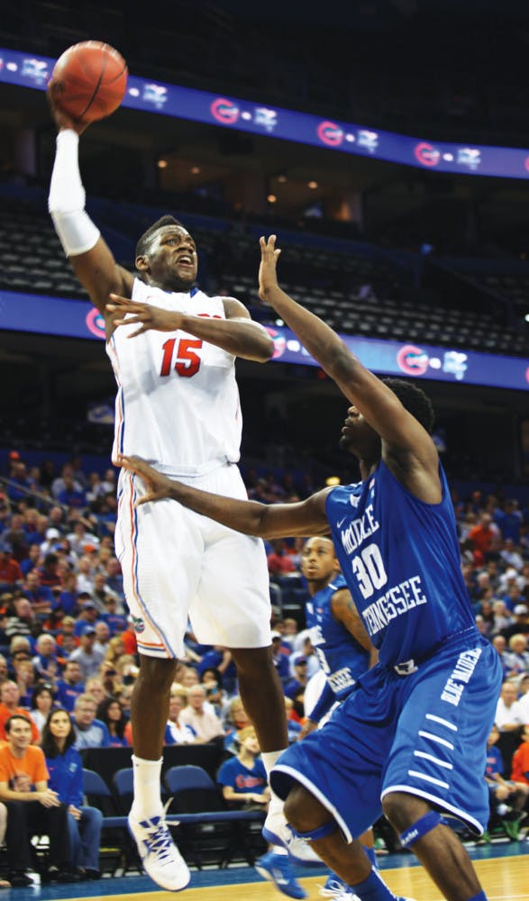Will Yeguete (15) shoots in UF’s 66-45 win against Middle Tennessee at the Tampa Bay Times Forum on Sunday. 
