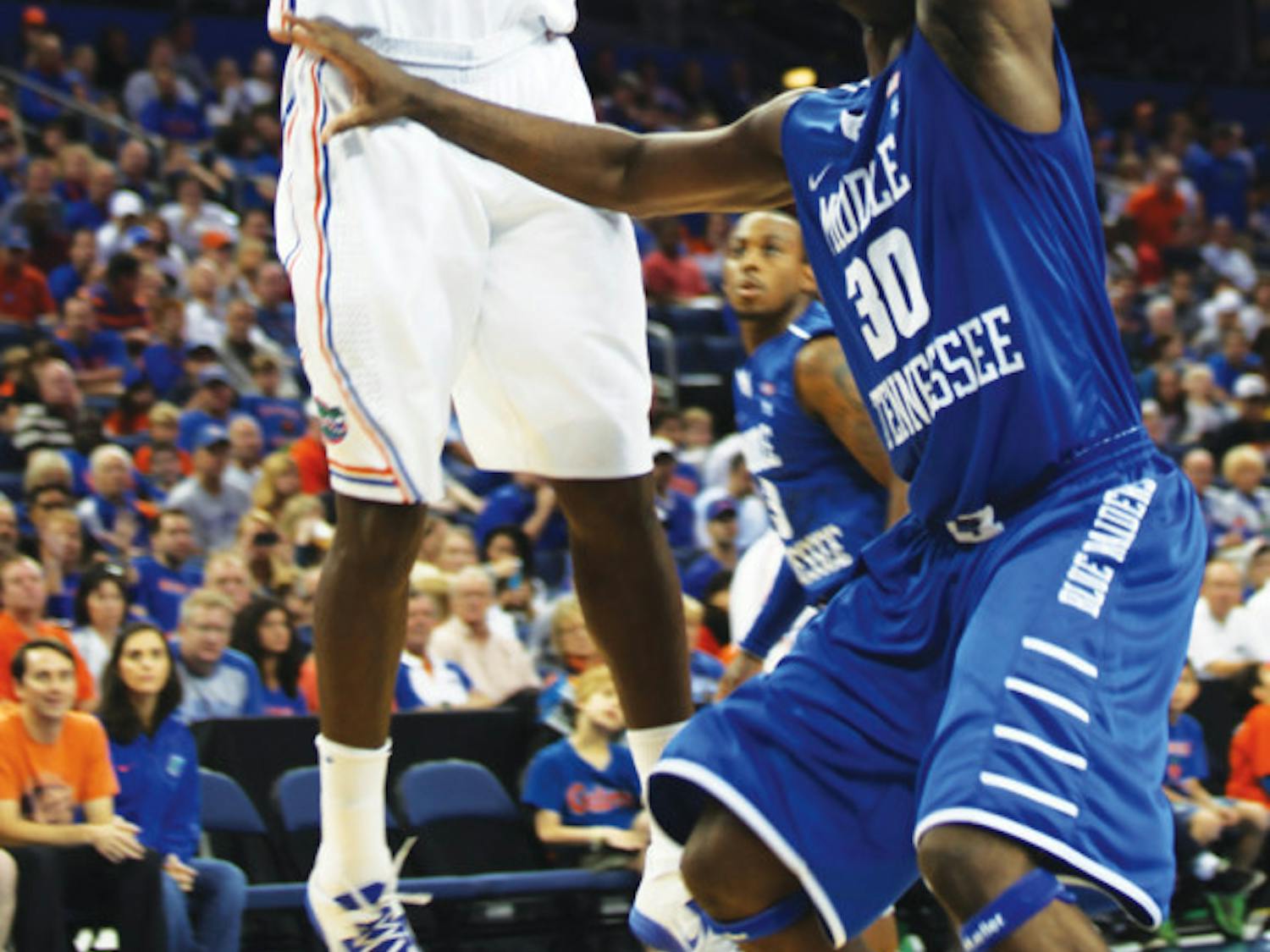 Will Yeguete (15) shoots in UF’s 66-45 win against Middle Tennessee at the Tampa Bay Times Forum on Sunday.