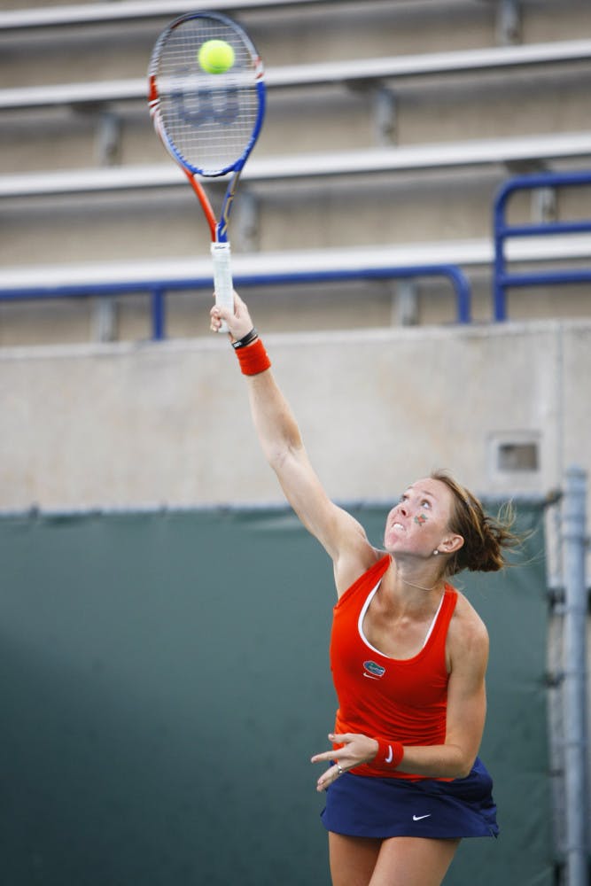 Senior Lauren Embree hits a ball in Linder Stadium. Embree won her singles match against Alabama in straight sets on Friday.