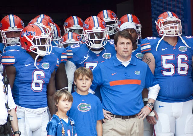 Florida coach Will Muschamp (front right) and the Gators have struggled to a .500 mark this year. However, they will become bowl eligible with a win against Furman on Saturday in Ben Hill Griffin Stadium.