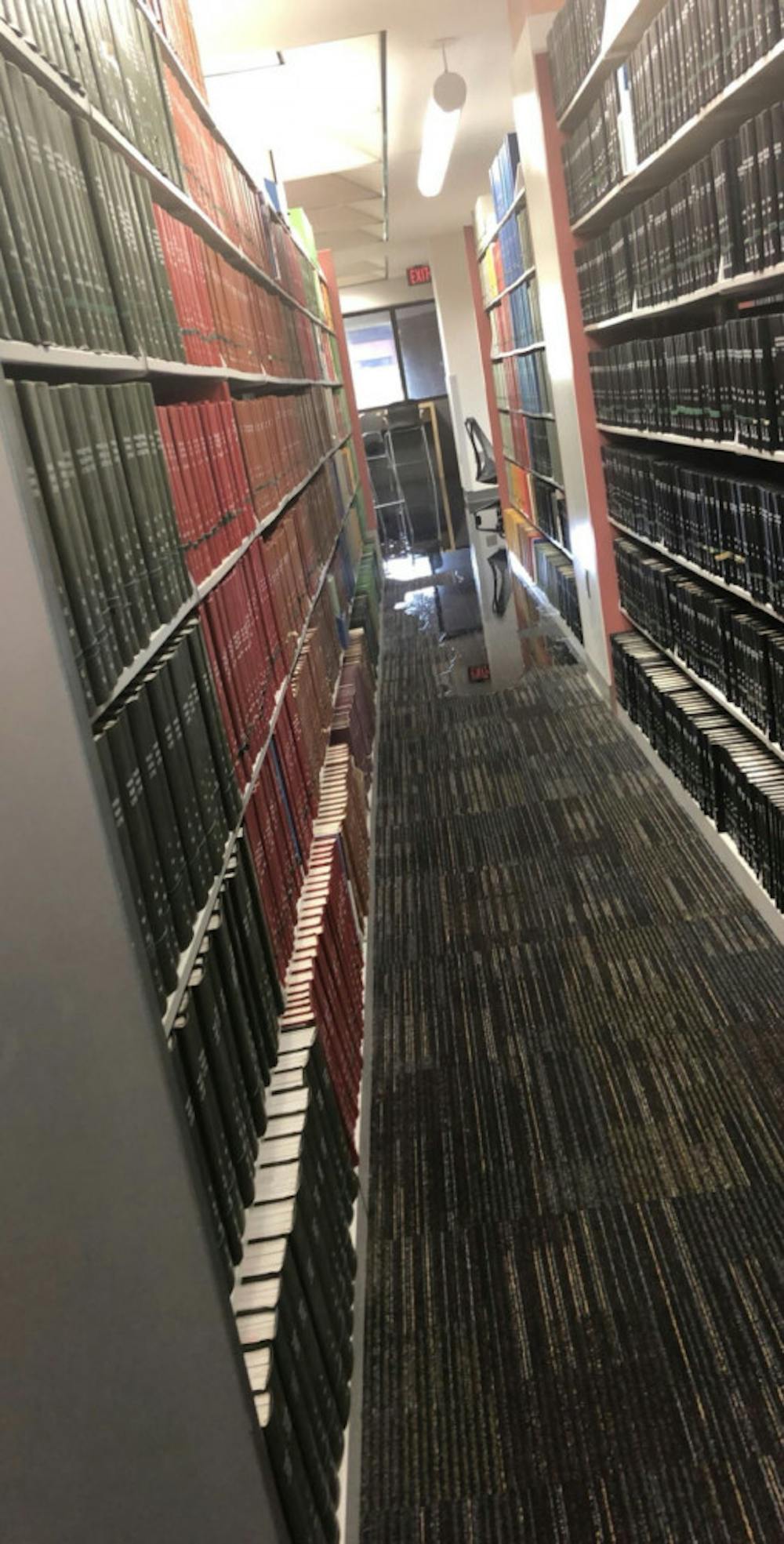 <p>Flooding reaching the book stacks at Marston Science Library</p>