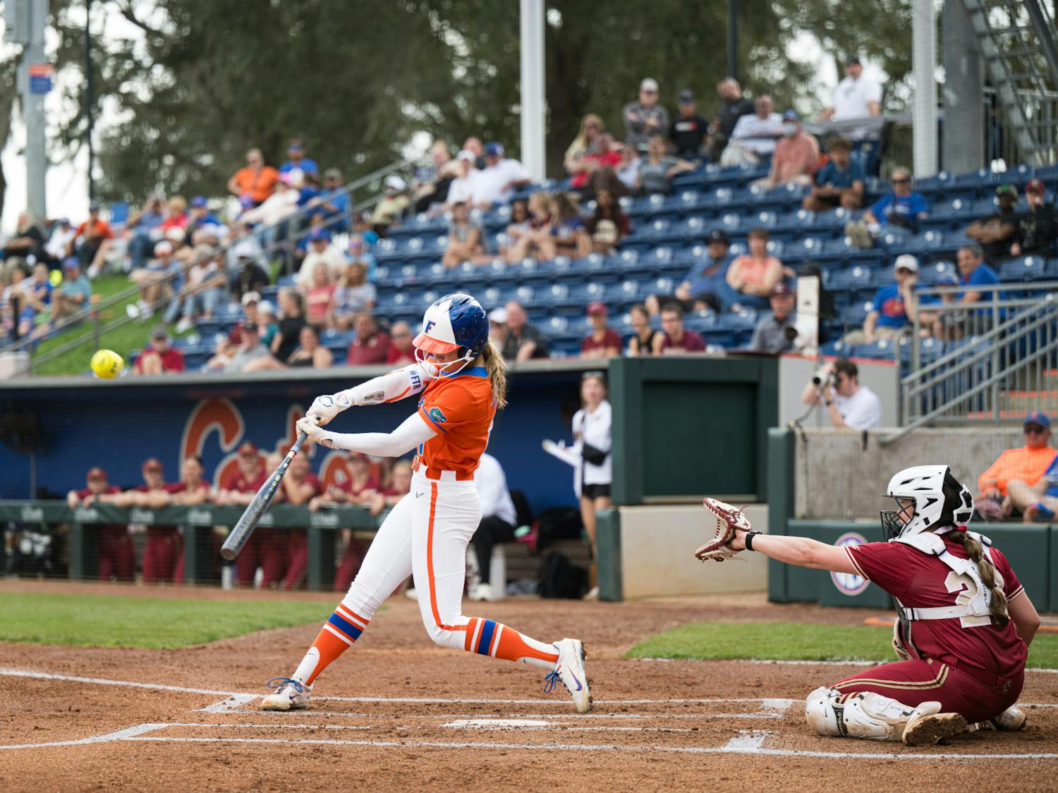 Florida Gators outfielder Taylor Shumaker (21) hits the ball in a softball game against Boston College in Gainesville, Fla., on Saturday, Feb. 15, 2025.