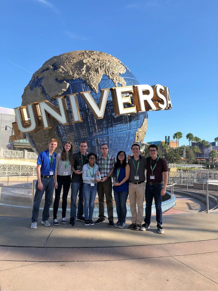 (From left to right) Matthew Musial, Sierra Simpson, Mark Lawrence, Andrea Wright, Justin Lawrence, Kaylyn Ling, Michael Breen and Kristofer Robinson hold their first place overall trophy at the Ryerson Invitational Thrill Design Competition at Universal Studios Florida. 