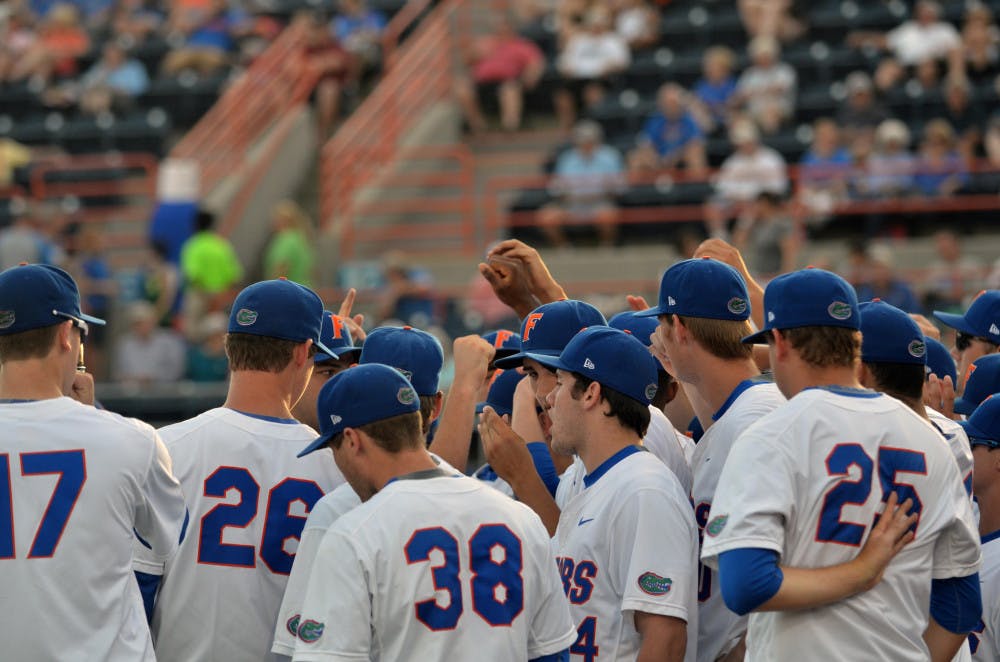 The Gators baseball team huddles prior to Florida's 14-3 win against the South Carolina Gamecocks on April 11, 2015 at McKethan Stadium.