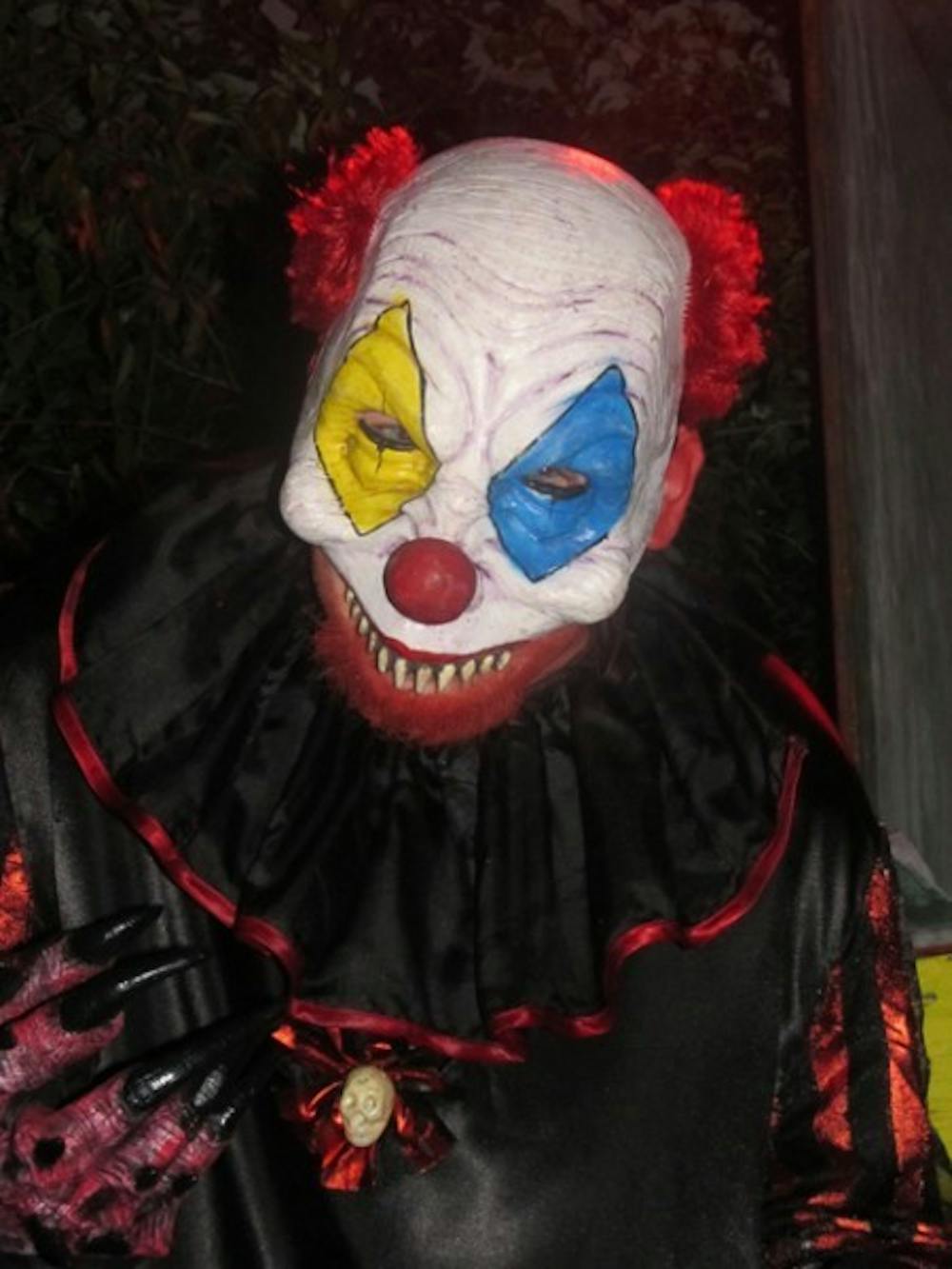 <p>Chuckles the Clown taunts unsuspecting travelers through the haunted trail at Eerie Acres.</p>