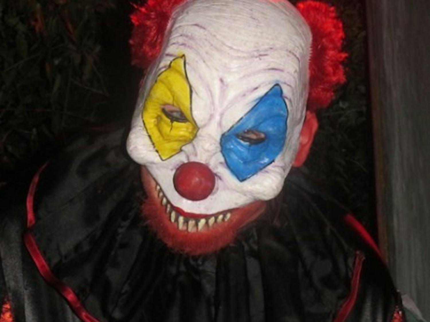 Chuckles the Clown taunts unsuspecting travelers through the haunted trail at Eerie Acres.