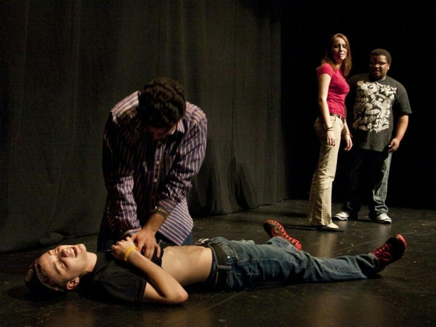 Local comedy troupe the Delta Group performs at the Gainesville Improv Festival on Thursday night.