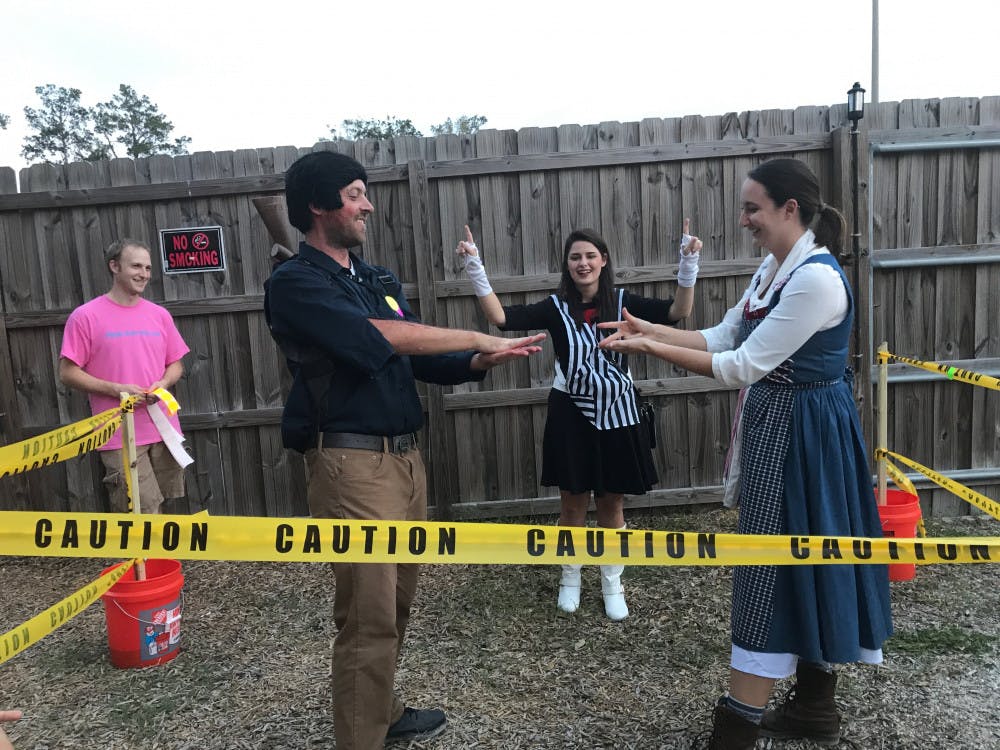 Leah Cobb-Lee, 28, beats her husband Benjamin Lee, 35, in the second round of the rock, paper, scissors tournament Saturday. The event raised money for the Keira Grace Foundation.