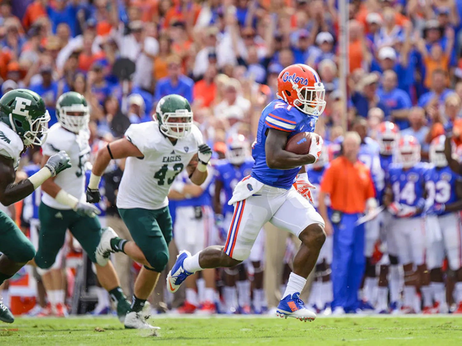 Kelvin Taylor runs 31 yards for a touchdown in the first quarter of Florida’s 65-0 win over Eastern Michigan on Saturday.