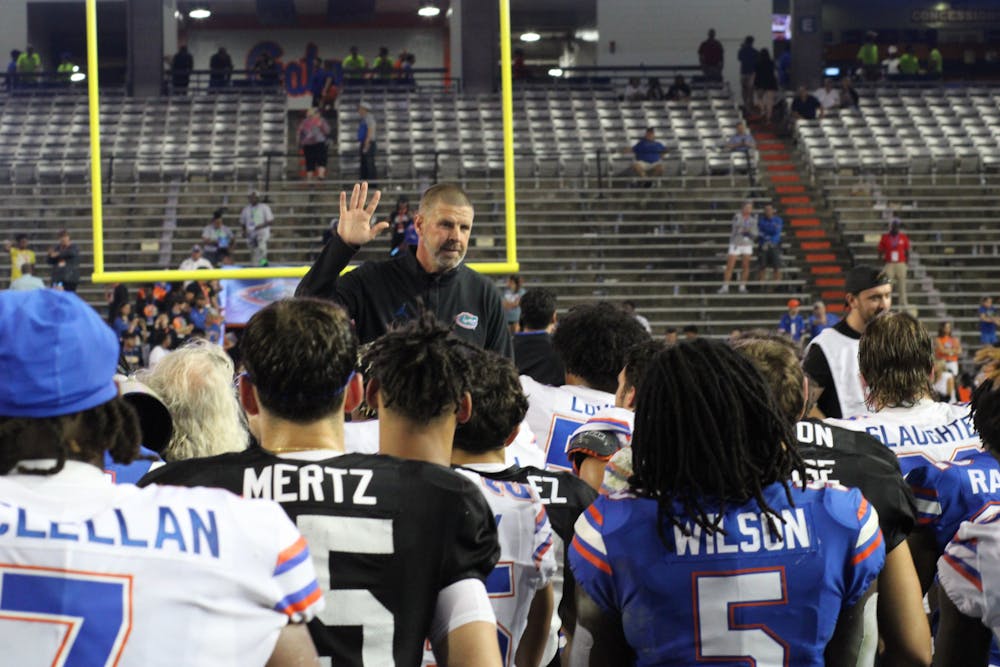 Florida football head coach Billy Napier talks to the Gators following UF's Orange and Blue Game Thursday, April 13, 2023.