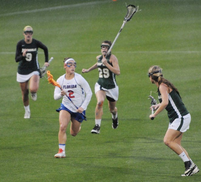 Sammi Burgess (2) drives toward the net during Florida’s 21-5 win against Jacksonville on Feb. 12 at Donald R. Dizney Stadium. Burgess scored three goals in UF’s win against Cincinnati on Sunday.