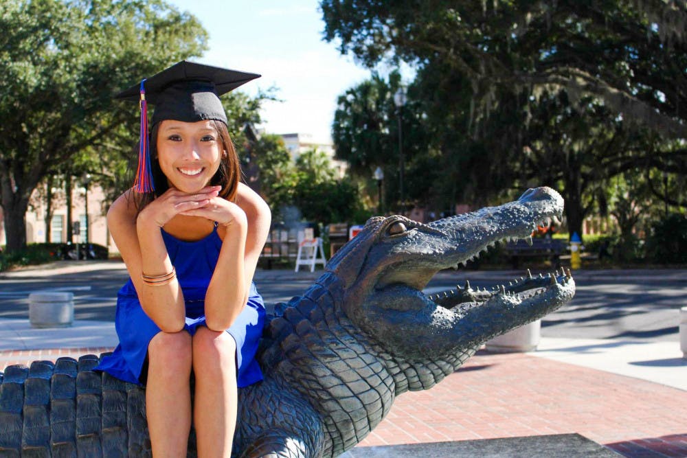 Roselle Derequito poses by the Bull Gator for her graduation photoshoot. Roselle graduated in 2014 with a bachelor’s degree in Health Education. 