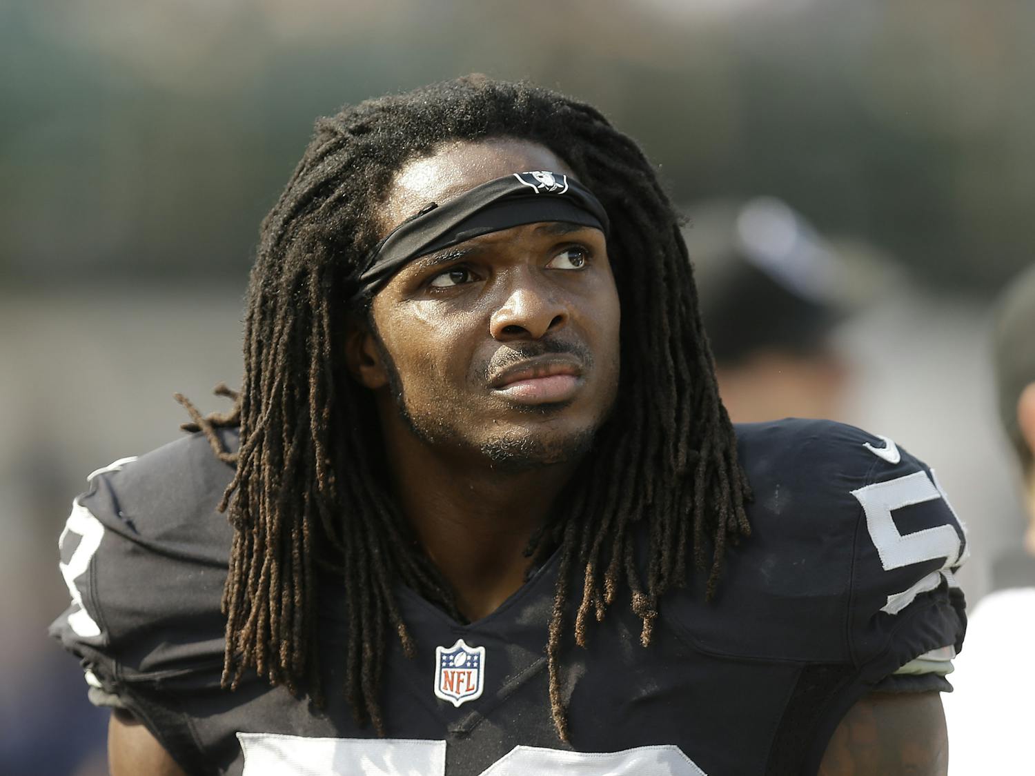 In this Sunday, Sept. 13, 2015 photo, Oakland Raiders outside linebacker Neiron Ball (58) stands on the sideline during the second half of an NFL football game against the Cincinnati Bengals in Oakland, Calif. Former Oakland Raiders linebacker Neiron Ball, who played college football at Florida after recovering from brain surgery, has died. He was 27.(AP Photo/Ben Margot)