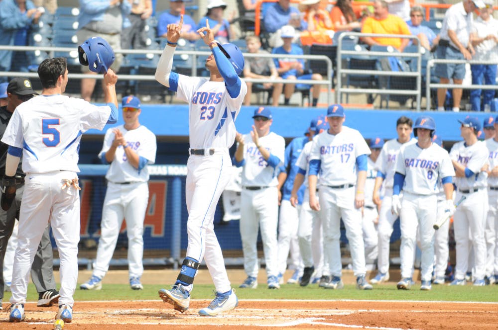 <p>Buddy Reed celebrates after hitting a home run during Florida's 7-5 win over Missouri on March 20, 2016, at McKethan Stadium.</p>
