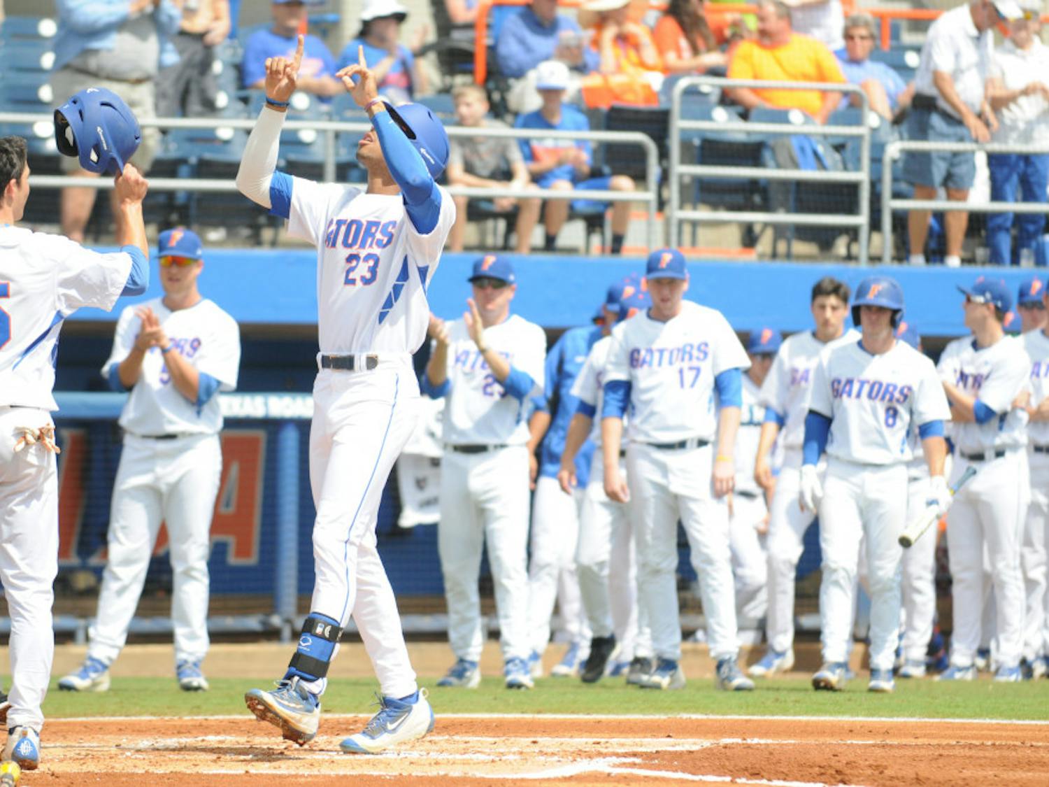 Buddy Reed celebrates after hitting a home run during Florida's 7-5 win over Missouri on March 20, 2016, at McKethan Stadium.