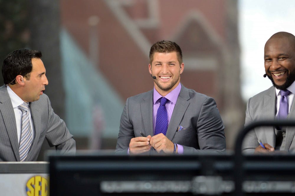 SEC Network's Joe Tessitore (left), Tim Tebow (center) and Marcus Spears (right) on the SEC Nation set located on UF's Plaza of the Americas on Friday.