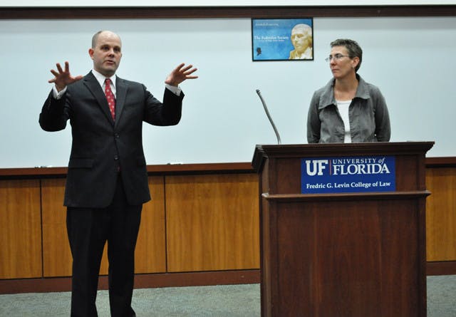 Austin Nimocks, senior legal counsel for the Alliance Defense Fund, and Danaya Wright, UF law professor, answer questions from the crowd after the "DOMA: Is it Constitutional?" debate discussing the constitutionality of the Defense of Marriage Act at the Levin College of Law on Wednesday.
