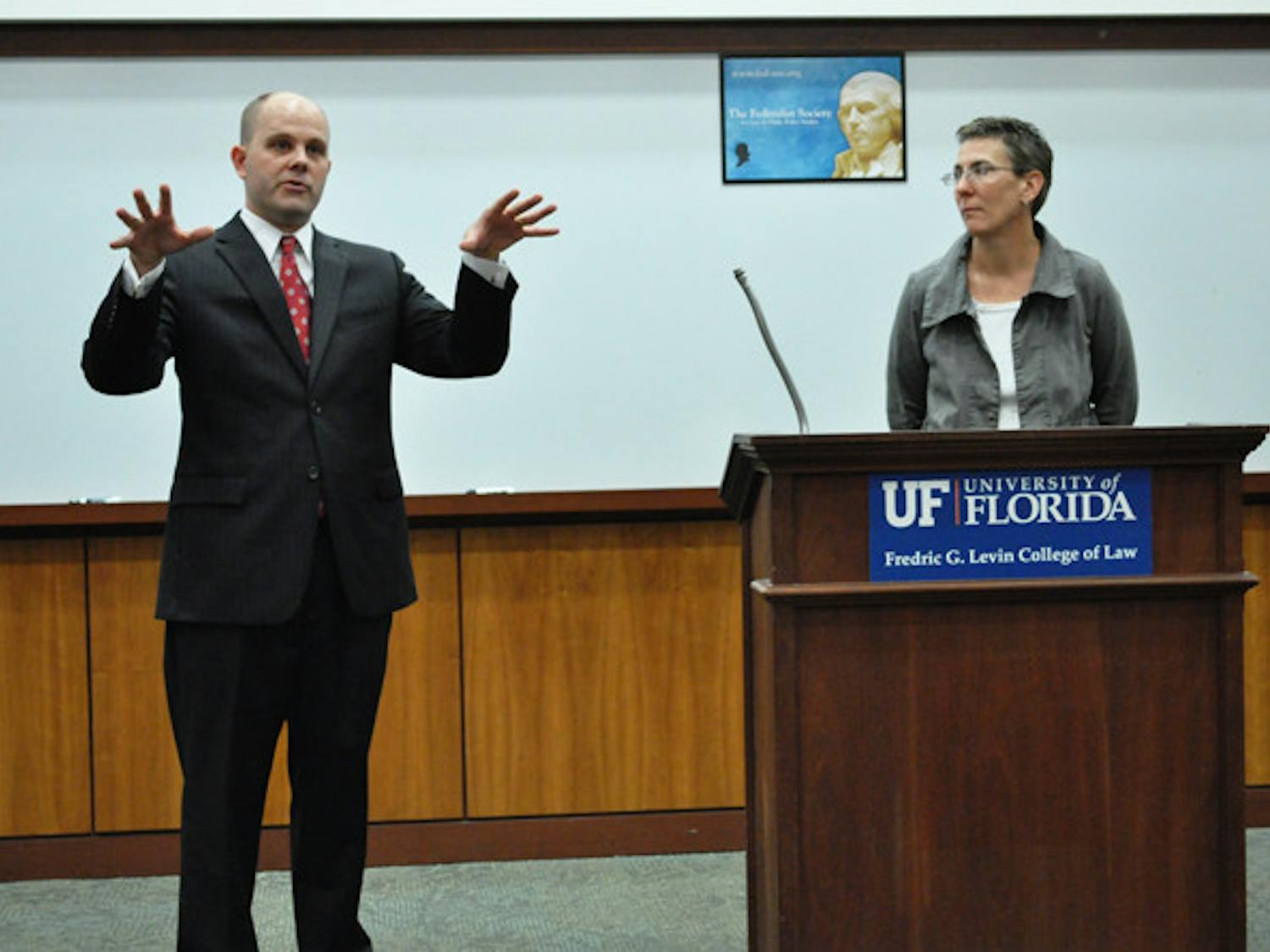 Austin Nimocks, senior legal counsel for the Alliance Defense Fund, and Danaya Wright, UF law professor, answer questions from the crowd after the "DOMA: Is it Constitutional?" debate discussing the constitutionality of the Defense of Marriage Act at the Levin College of Law on Wednesday.