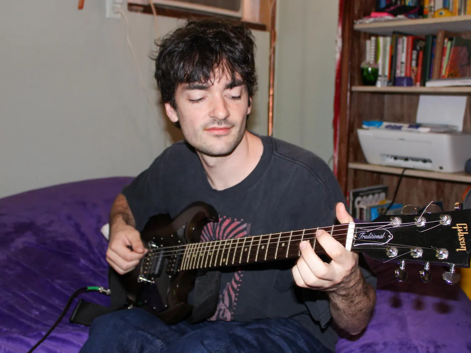 Luke Sechrest, a member of the local band Rustler, plays his guitar Friday, August 21, 2026, in Gainesville, Fla.