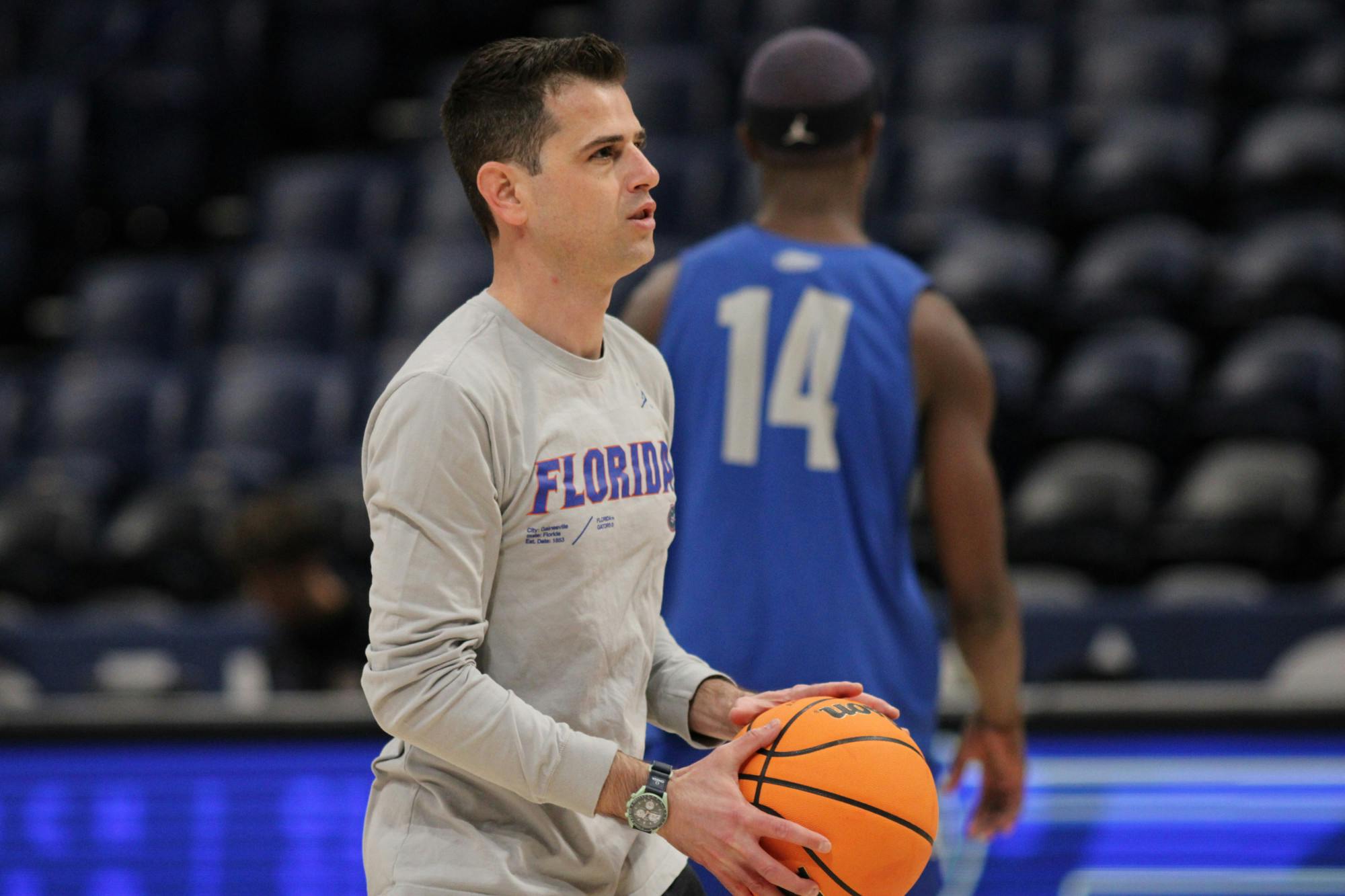 Florida Gators head coach Todd Golden holds a ball during a a practice before the SEC men's basketball tournament Wednesday, March 8, 2023.