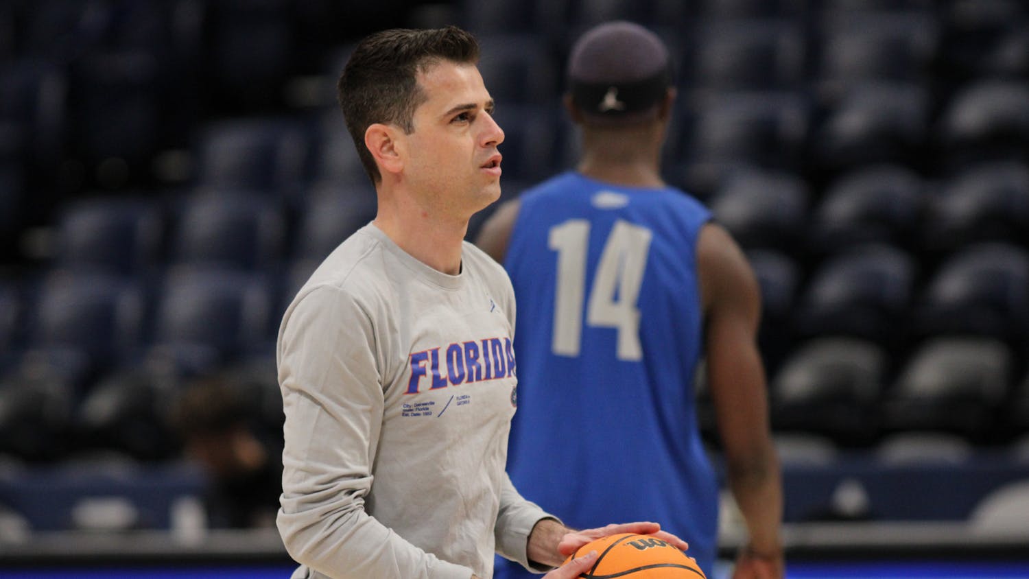 Florida Gators head coach Todd Golden holds a ball during a a practice before the SEC men's basketball tournament Wednesday, March 8, 2023.