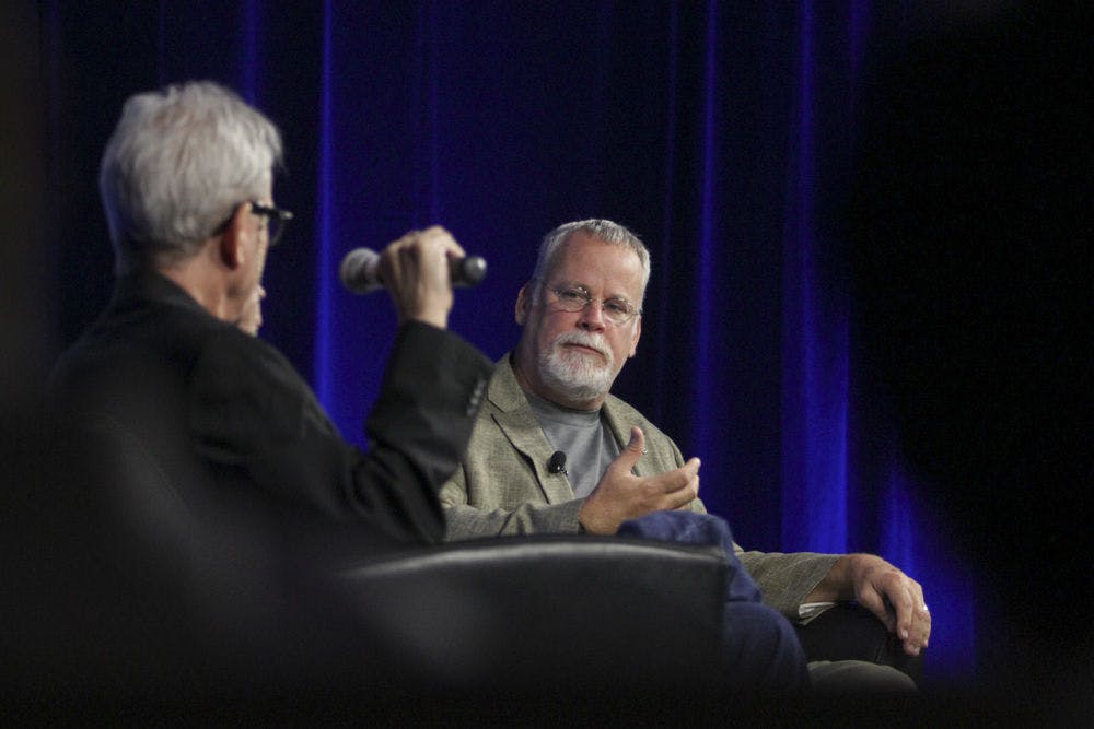 Mike Foley (left), a UF master lecturer in the College of Journalism and Communications, interviews best-selling writer and UF alum Michael Connelly in Gannett Auditorium on Sept. 21, 2015. Connelly spoke about storytelling and his career shift from reporter to novelist.