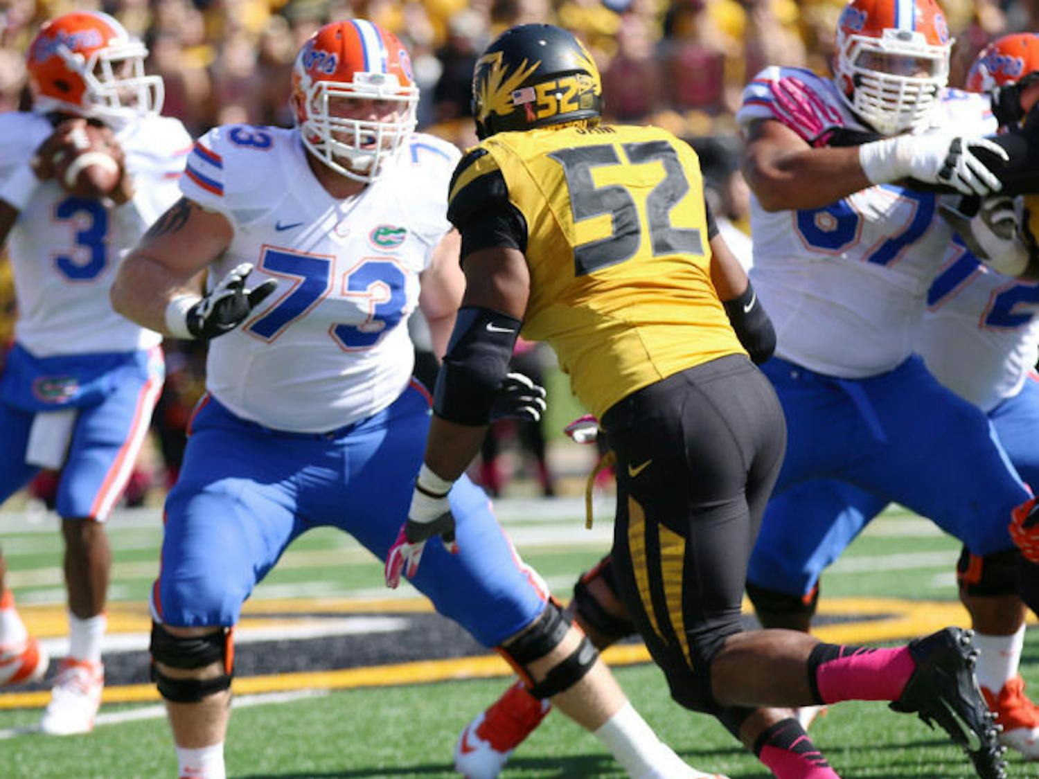 Florida offensive lineman Tyler Moore (73) attempts to block Missouri defensive lineman Michael Sam (52), who leads the nation with nine sacks and 13 tackles for a loss, during the Gators’ 36-17 loss against the Tigers on Saturday at Faurot Field in Columbia, Mo. The UF offensive line surrendered six sacks to Missouri.