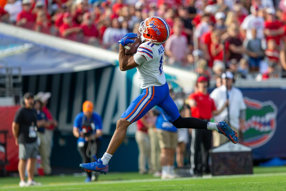 <p>Florida Gators wide receiver Aidan Mizell (11) catches a touchdown pass from Florida Gators quarterback DJ Lagway (2) during the first half at TIAA Bank Field on Saturday, November 02, 2024.</p>