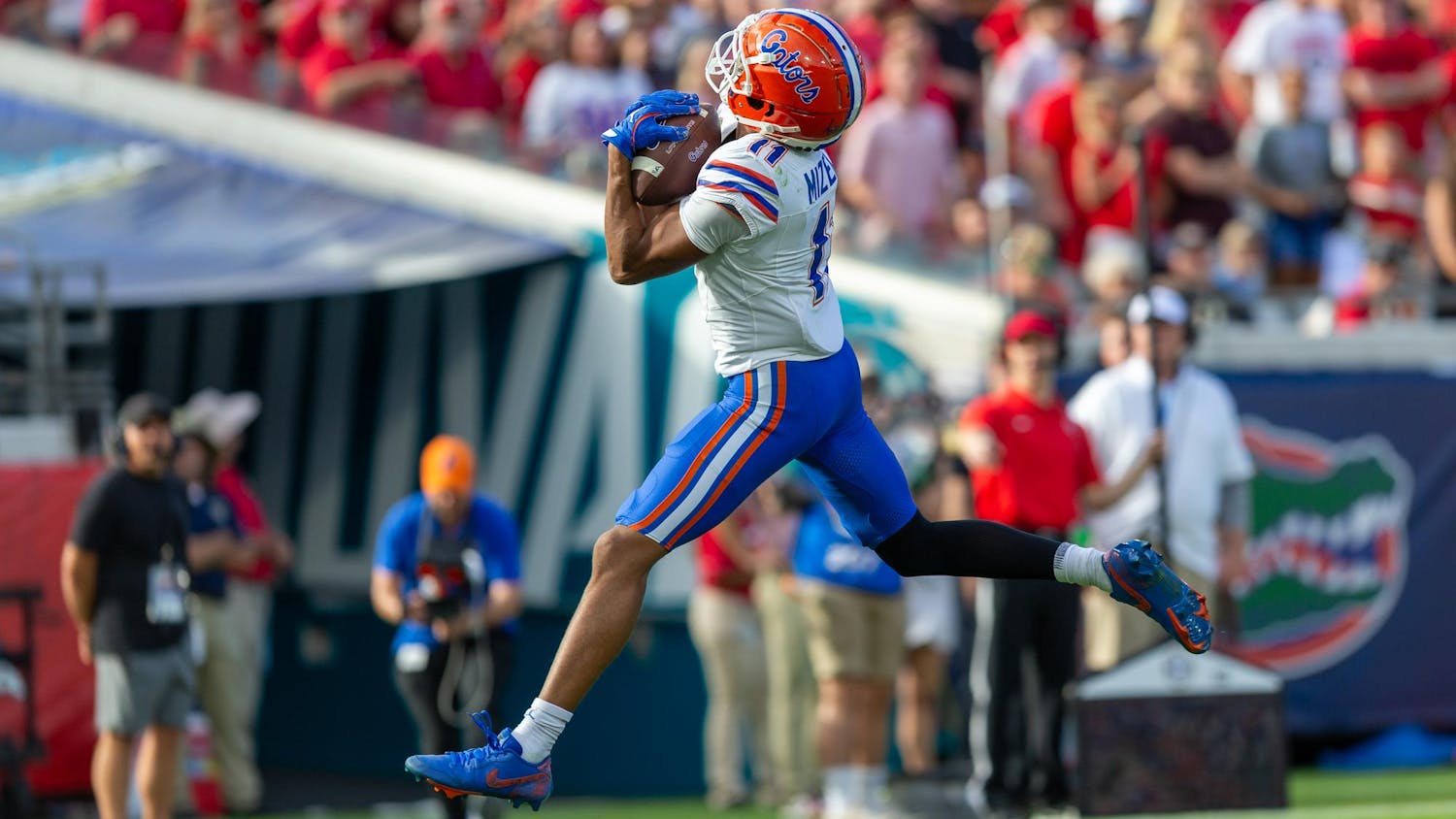 Florida Gators wide receiver Aidan Mizell (11) catches a touchdown pass from Florida Gators quarterback DJ Lagway (2) during the first half at TIAA Bank Field on Saturday, November 02, 2024.